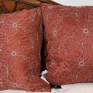 Set of rust accent pillows